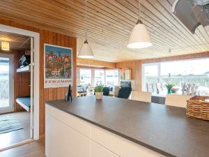 a kitchen with a large counter top in a room at 5 person holiday home in Sæby-By Traum in Sæby