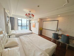 Ένα ή περισσότερα κρεβάτια σε δωμάτιο στο Qingsu Shanghai Main Branch