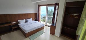 Ένα ή περισσότερα κρεβάτια σε δωμάτιο στο Opal Villas