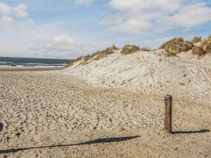 a pole in the sand on a beach at 5 person holiday home in Henne-By Traum in Henne Strand