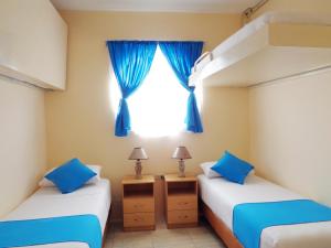 Postel nebo postele na pokoji v ubytování Hotel Crucero