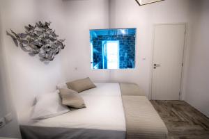 Posteľ alebo postele v izbe v ubytovaní Paros Afrodite Luxury Villas