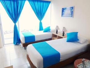 Postel nebo postele na pokoji v ubytování Hotel Crucero