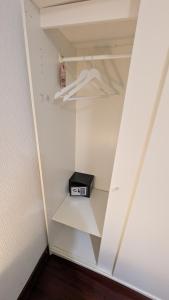 a closet with a shelf with a clock on it at Casa Santa Barbara in Donostia-San Sebastián