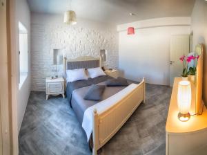 Posteľ alebo postele v izbe v ubytovaní Paros Afrodite Luxury Villas