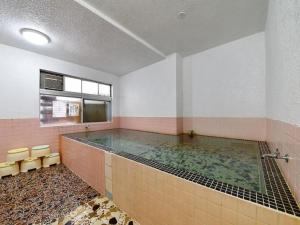 a large pool of water in a room at Sports Plaza Shirakaba in Tokamachi