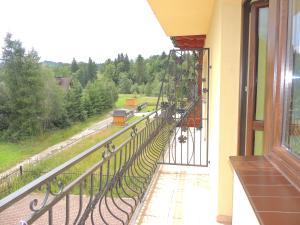 A balcony or terrace at Apartamenty Bajka Białka Tatrzanska z Kuchnią