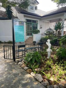 a sign in front of a house at Rosie Garden & Home in Ban Bung +2 photos