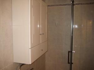 a shower with a white cabinet in a bathroom at Mirador del Roque in Órzola