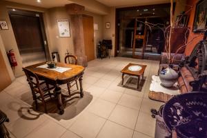 a living room with a table and a couch at L Ecrevisse in Wissembourg