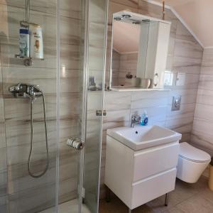 a bathroom with a shower and a sink at CASA Maria in Orlat