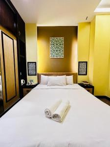 Кровать или кровати в номере Hotel El Zahraa