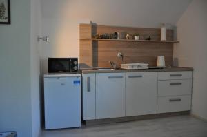 Kuchyň nebo kuchyňský kout v ubytování Simpli Apartments