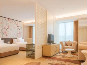 a rendering of a hotel room with a bedroom at Zhongshan Da Dong Yu Hotel in Zhongshan