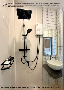 a shower in a bathroom with a sink and a mirror at Koh Larn White House in Ko Larn +93 photos