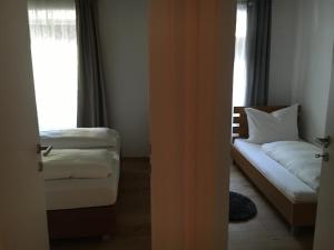 Posteľ alebo postele v izbe v ubytovaní Apartment Enzinger