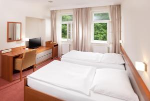 Postel nebo postele na pokoji v ubytování Hotel Reza
