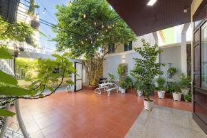a courtyard with potted plants in a building at Danang's house in Da Nang