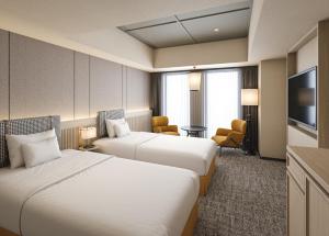 Ένα ή περισσότερα κρεβάτια σε δωμάτιο στο Premium hotel MONday MAIHAMA View 1