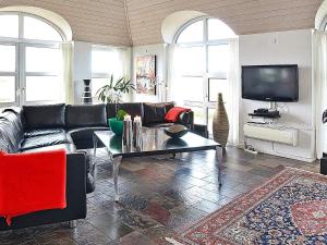 a living room with a couch and a coffee table at Luxury Seaside Retreat - By Traum Ferienwohnungen in Søndervig