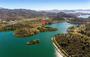 an aerial view of a lake with a red balloon at Gorgeous Apartment In Bacina in Baćina +41 photos