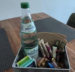 a bottle of water sitting on top of a table at Juliusruh Strandparadies 6 in Juliusruh