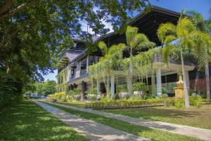 a house with a garden in front of it at Sigiriya Kingdom Resort in Dambulla