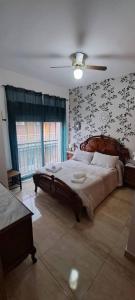 Ένα ή περισσότερα κρεβάτια σε δωμάτιο στο Apartamento Calle Real