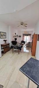 a living room with a couch and a table at Apartamento Calle Real in Martos +9 photos