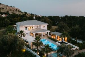 an aerial view of a house with a swimming pool at M Mansion in Pefki