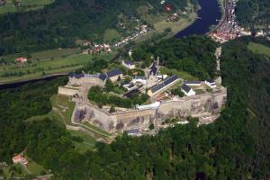 an aerial view of a castle on a hill at Bergapartment in Königstein an der Elbe