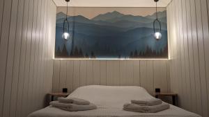 Ένα ή περισσότερα κρεβάτια σε δωμάτιο στο Lavochne Villas