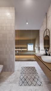 a bathroom with two sinks and a mirror at Zug503 Appartement in Lech am Arlberg in Lech am Arlberg