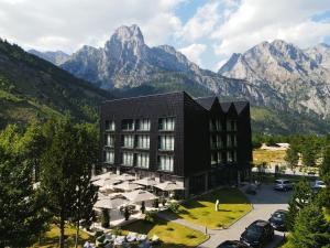 an aerial view of a hotel with mountains in the background at Hotel Valbor in Tropojë