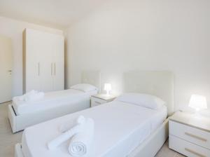 Ένα ή περισσότερα κρεβάτια σε δωμάτιο στο Nour Apartments - Castramajora Alloggi