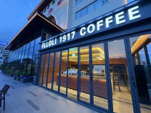 a coffee shop with a sign on the front of it at Atour Hotel Guangzhou Railway Station University of Chinese Medicine - Complimentary Self-Service Laundry in Guangzhou