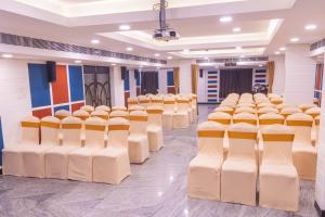 a room with rows of chairs in a classroom at Hotel Comfort Park - Opposite Sri Ramachandra Medical College Porur in Chennai
