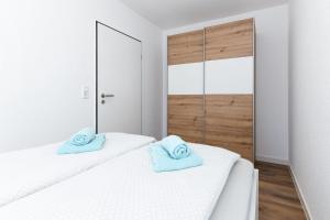 Postel nebo postele na pokoji v ubytování Seekieker - Nordseewelle