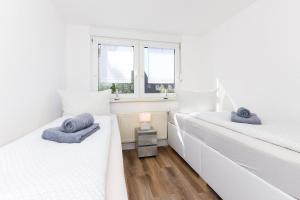 Postel nebo postele na pokoji v ubytování Seekieker - Abendstern