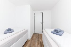 Postel nebo postele na pokoji v ubytování Seekieker - Abendstern + 14 fotografií