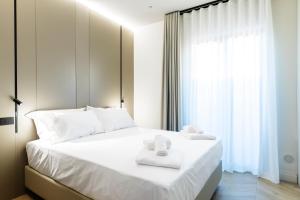 Llit o llits en una habitació de Bfor Hotel