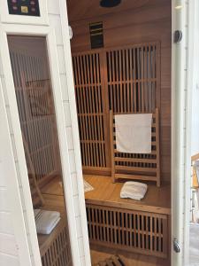 a sauna with two towels inside of it at Maison avec Sauna Saint-Valery-sur-Somme in Saint-Valery-sur-Somme