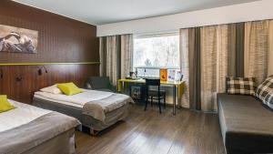 a hotel room with two beds and a desk at Finlandia Hotel Airport Oulu in Kempele +42 photos