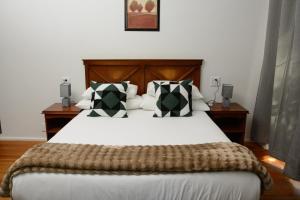 En eller flere senge i et værelse på Die Veldskoen