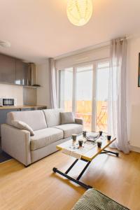 Posezení v ubytování Cocon Chic - 1 Chambre