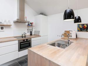 a kitchen with a sink and a counter top at 4 star holiday home in Bogense in Bogense