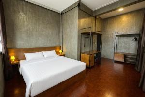 Ένα ή περισσότερα κρεβάτια σε δωμάτιο στο Lanna Loft Hostel +49 φωτογραφίες