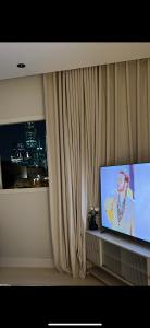 a flat screen tv sitting in front of a window at Studio in Al-Aqiq شقه رقم 15 و in Riyadh