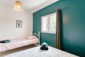 Ένα ή περισσότερα κρεβάτια σε δωμάτιο στο Appartement Spacieux 80 m2