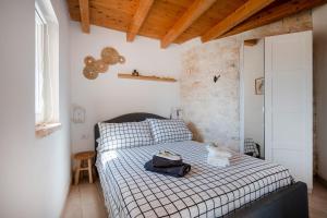 Postel nebo postele na pokoji v ubytování Il Trullo di Grace Castellana